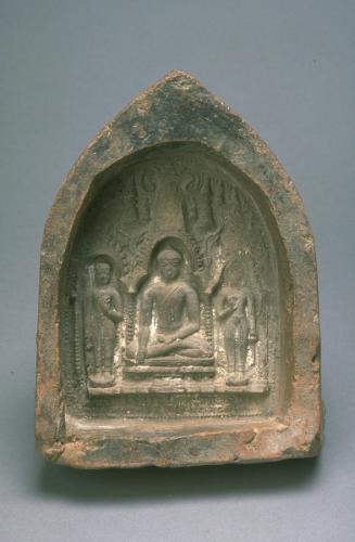 Votive tablet with seated Buddha flanked by standing Buddhas