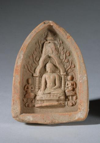 Votive tablet with seated Buddha flanked by kneeling disciples