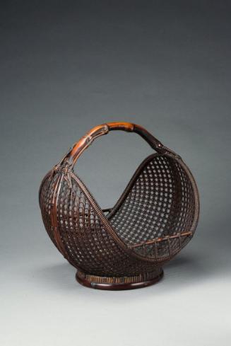 Basket with bamboo rhizome handle