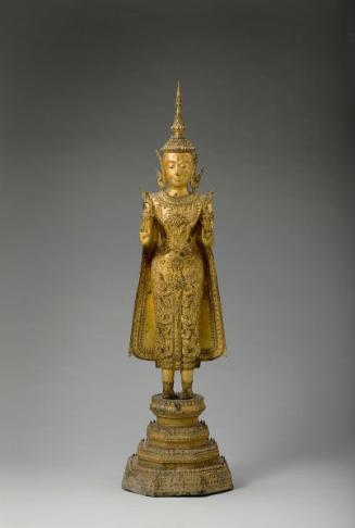 Standing crowned and bejeweled Buddha