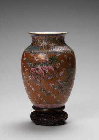 Vase with design of lions playing ball
