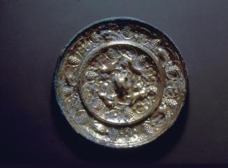 Mirror with mythical beasts amid grapes