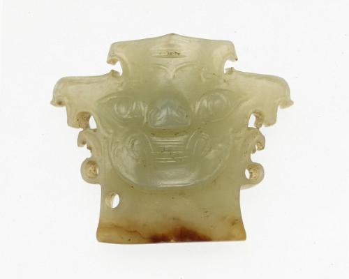 Ornament with monster-mask motif