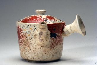 Tea pot with design of maple leaves and flowers