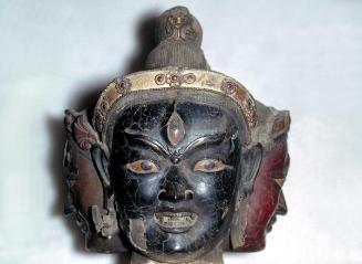 Three heads from an image of a deity