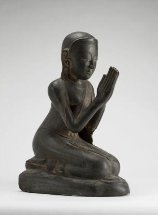 A monk in worshipful posture, probably the Buddha's disciple Maudgalyayana
