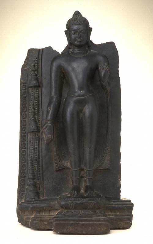 Standing Buddha with stupas