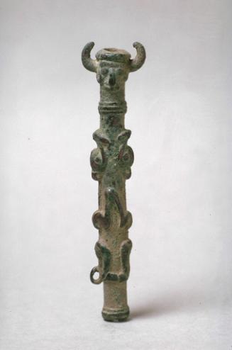 Finial with faces