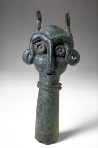 Finial with faces