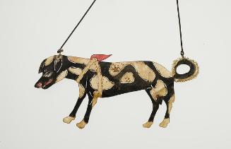 White spotted black dog with harness