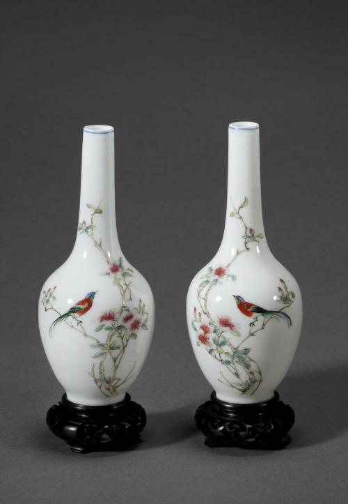 Vase with bird on blossoming branch