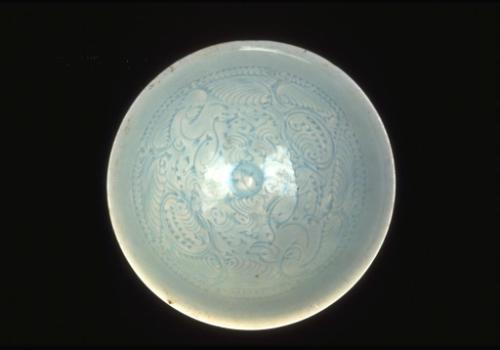 Bowl depicting two boys playing amid lotus scrolls