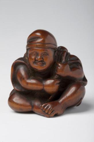 Ebisu, god of merchants and fishermen, with sea bream pull toy
