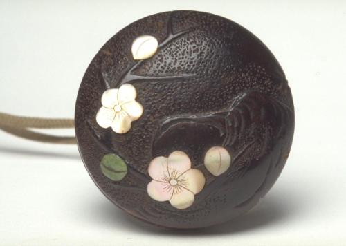 Netsuke of plum blossom laden branch 
