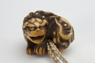 Netsuke of recumbent lion
