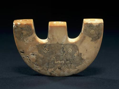 Three-pronged plaque with animal masks
