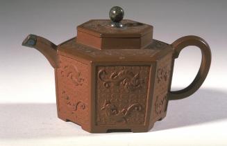 Hexagonal teapot with molded decoration