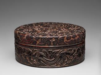 Round box with design of dragons playing amid clouds