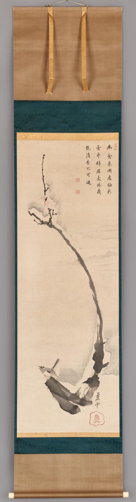Bird on a plum branch in snow
