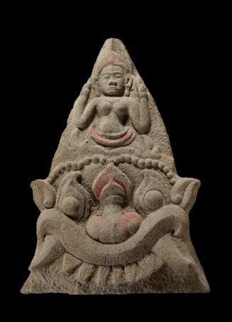 Architectural element with monster face and female deity