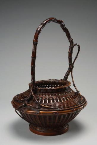 Flower basket in the shape of a toy top
