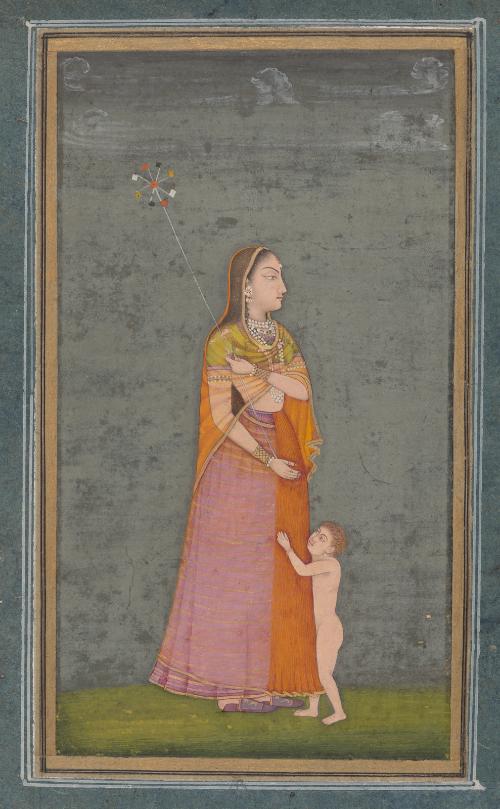 Woman holding a pinwheel, accompanied by a child