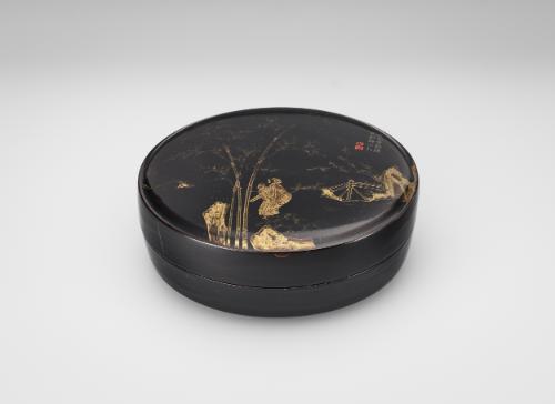 Round box with set of nine smaller boxes inside
