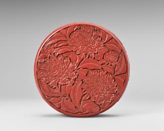 Lidded box with carved flower designs