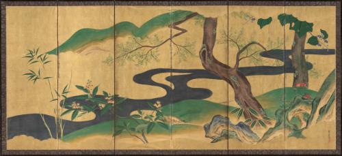Flowering plants by a flowing waterfall