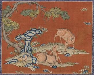 Deer under a juniper tree with bats and longevity rock