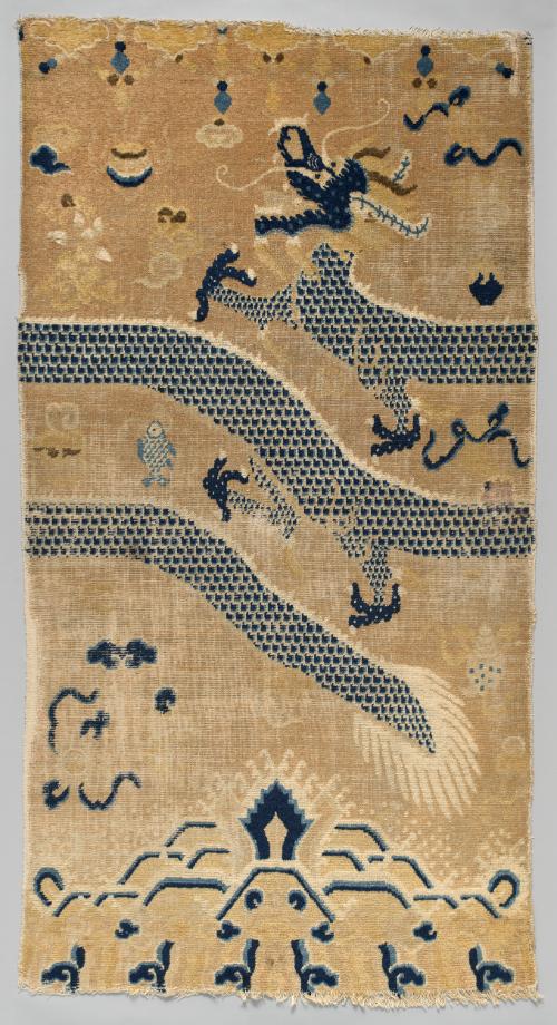 Rug with a design of a dragon amid treasures