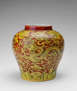 Jar with design of dragons amid clouds